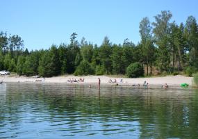 Child-friendly long sandy beach with shallow waters